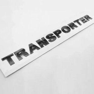 Купити Емблема напис TRANSPORTER Чорний глянець 340x25 мм для Volkswagen Пластик на скотчі (Заводський) 88570 Емблема напис на іномарки